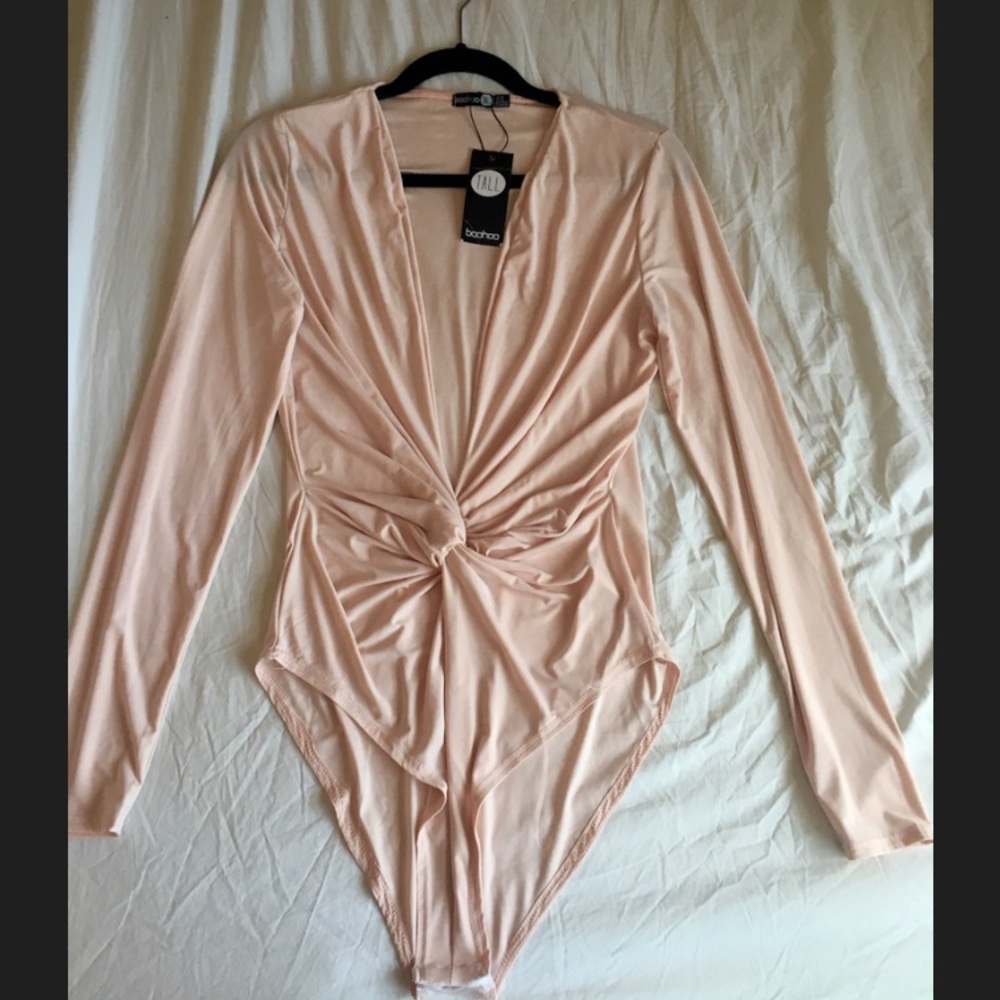 Long sleeve peach colored bodysuit.